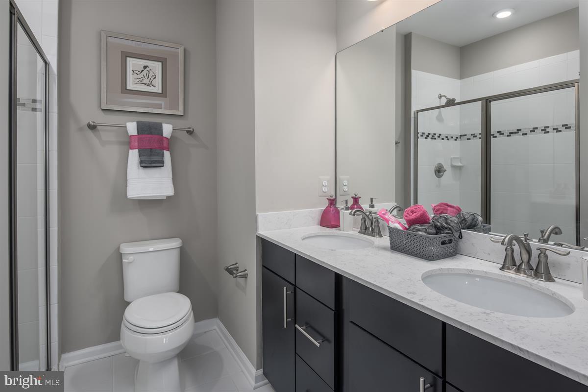 3003 Frayser Farm Road Hanover, MD 21076 - Photo 12 of 19 a bathroom with a toilet sink and mirror