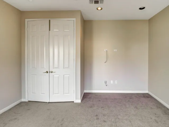 a bathroom with a sink toilet vanity and shower