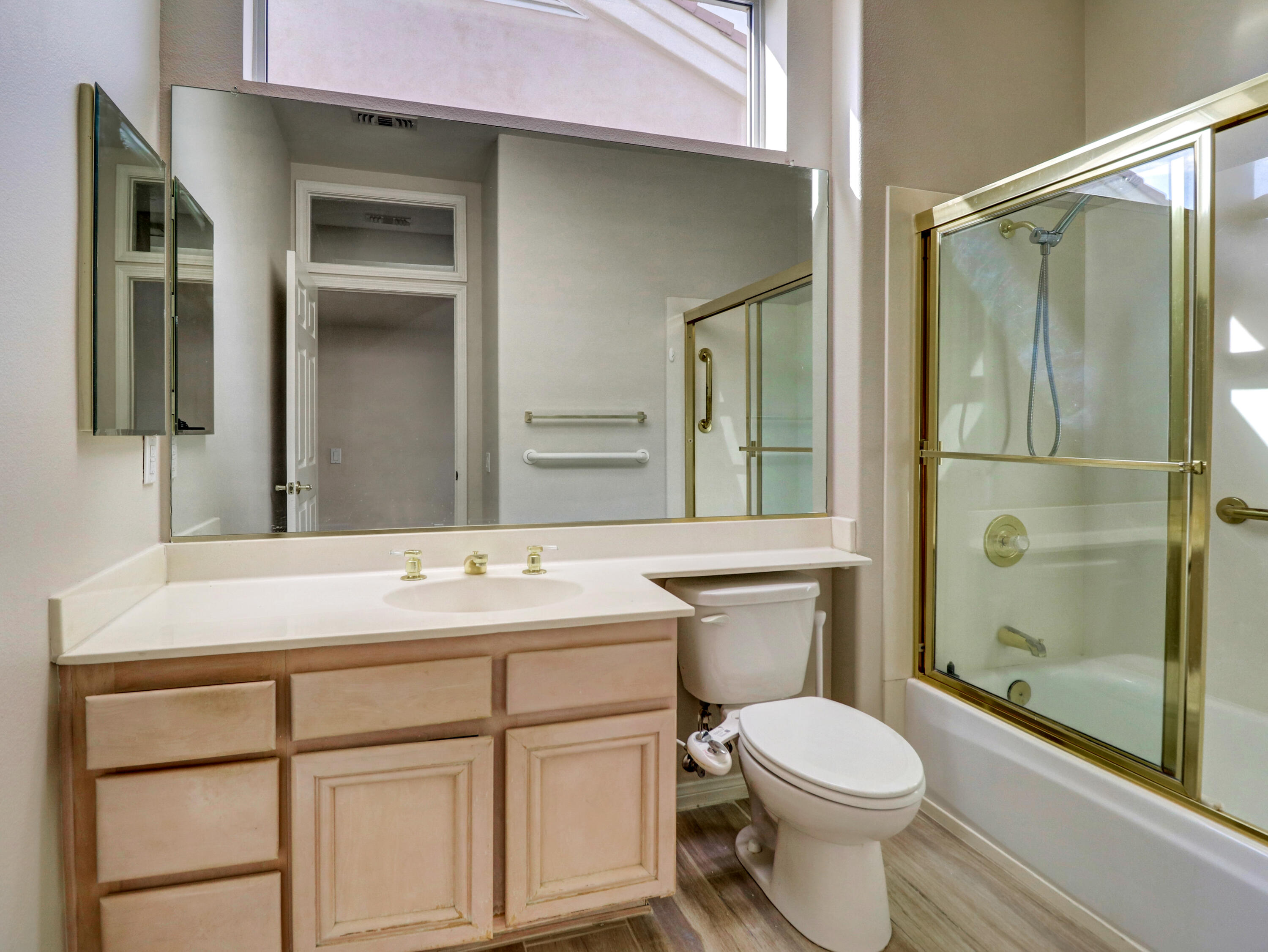 38574 Clear Sky Way Palm Desert, CA 92211 - Photo 16 of 69 a bathroom with a sink toilet vanity and shower