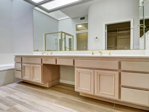 a kitchen with stainless steel appliances granite countertop a refrigerator a stove and a sink with granite countertops
