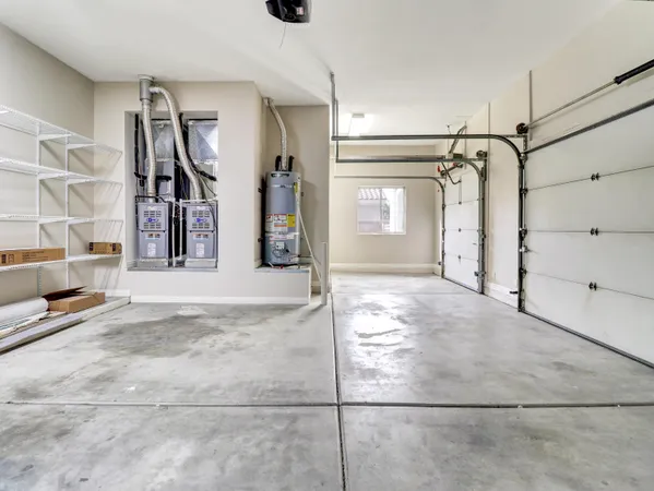 a kitchen with kitchen island a large window in it