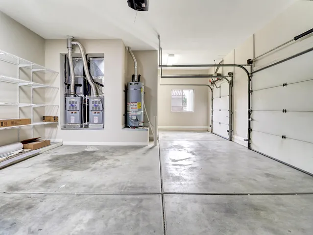 a kitchen with kitchen island a large window in it