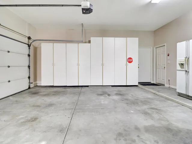 a view of a house with backyard and porch
