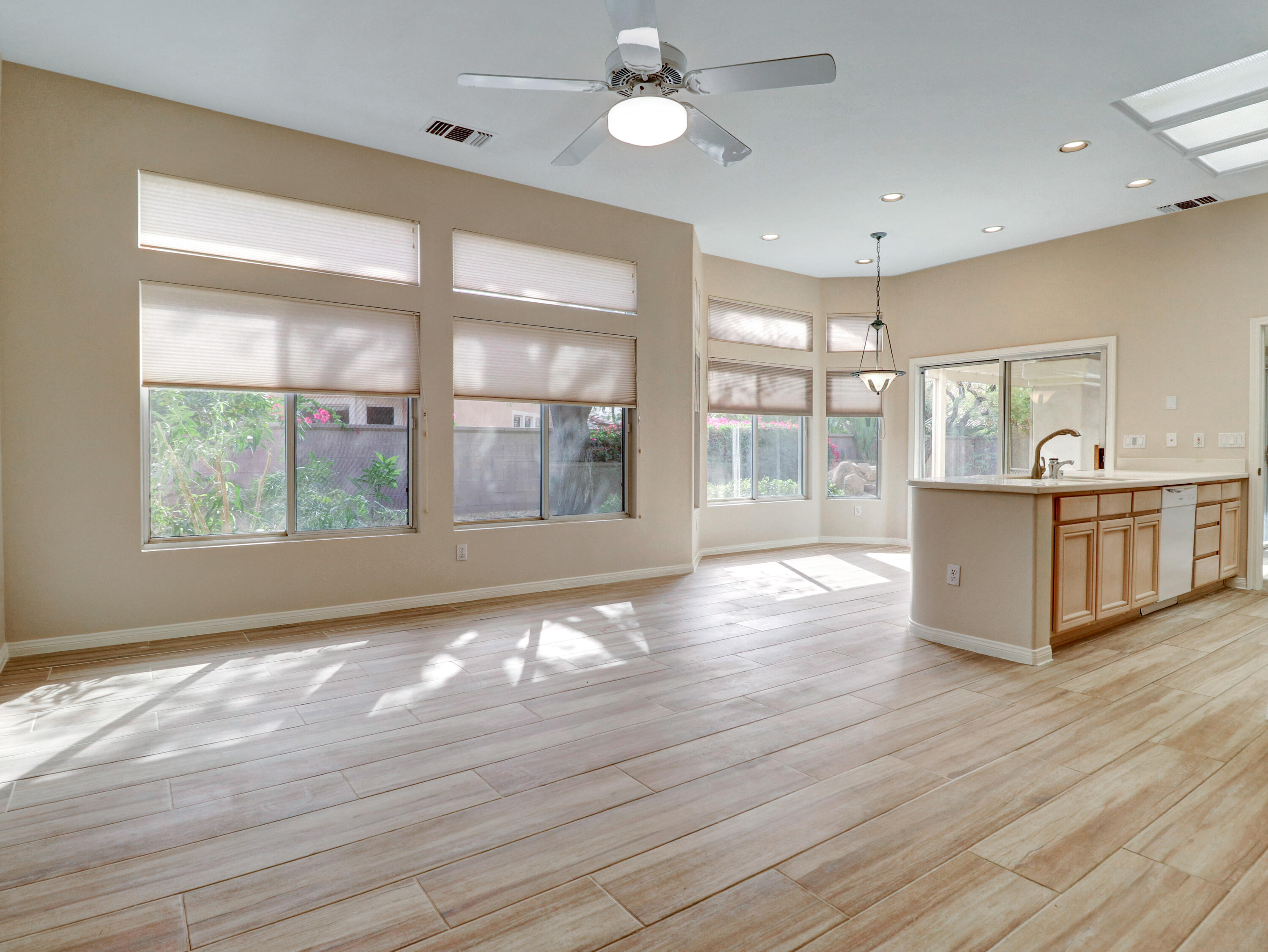 38574 Clear Sky Way Palm Desert, CA 92211 - Photo 34 of 69 a view of an empty room with a window and wooden floor