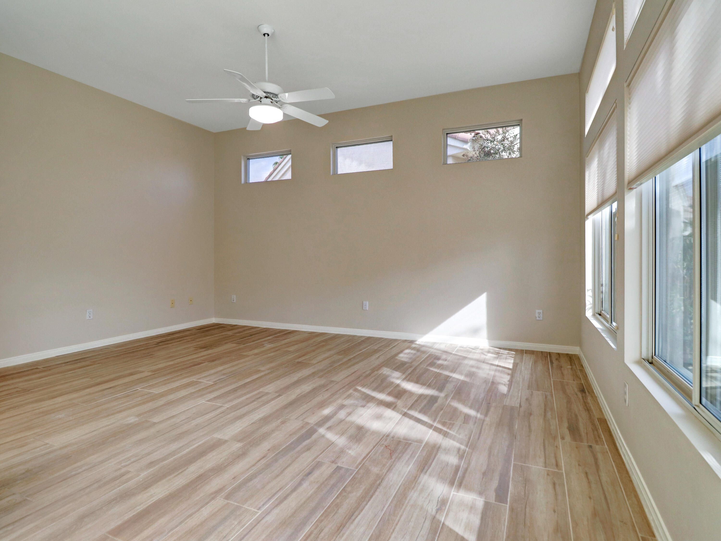 38574 Clear Sky Way Palm Desert, CA 92211 - Photo 35 of 69 wooden floor in an empty room with a window