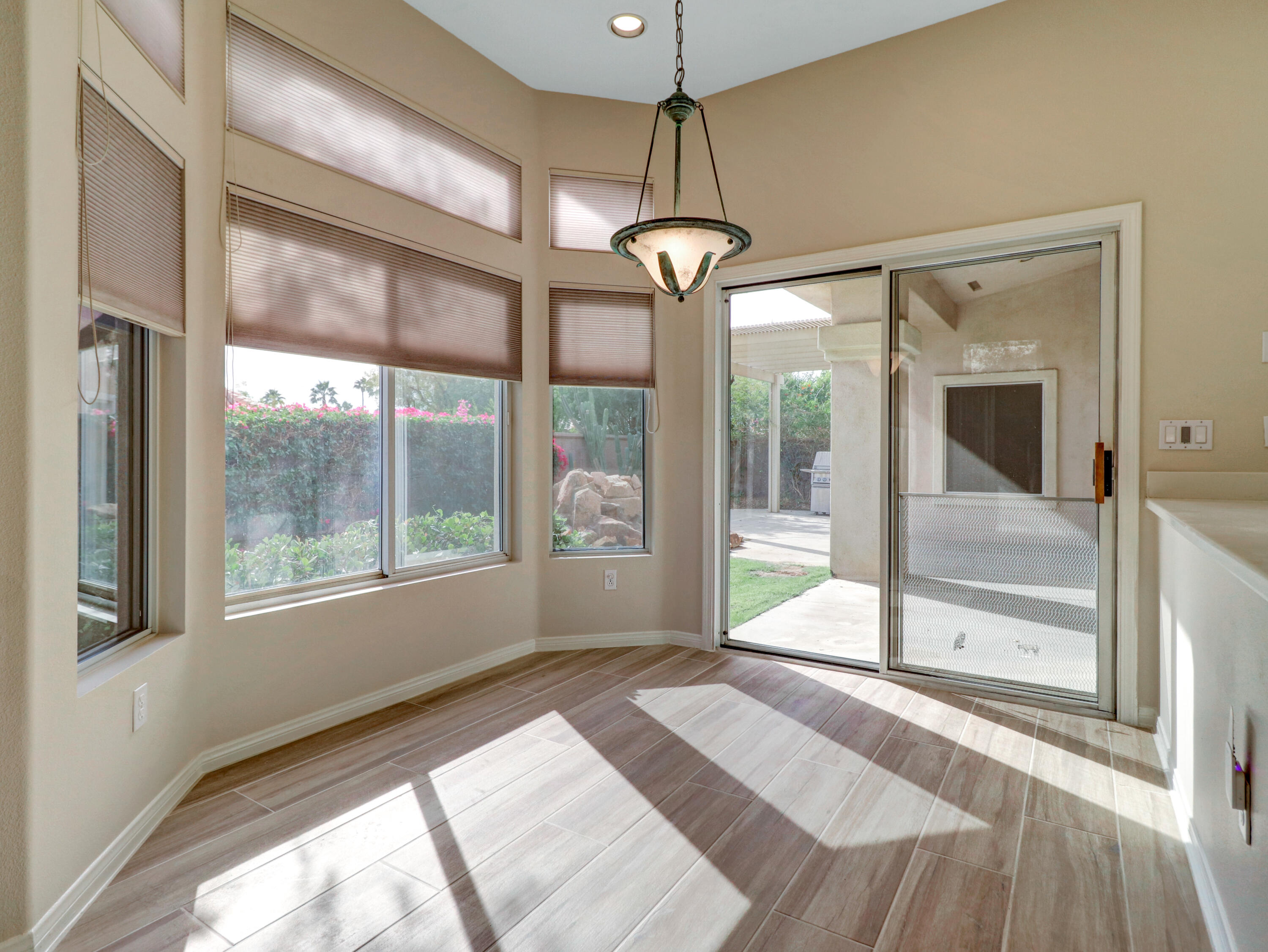 38574 Clear Sky Way Palm Desert, CA 92211 - Photo 36 of 69 a view of an entryway with wooden floor and door