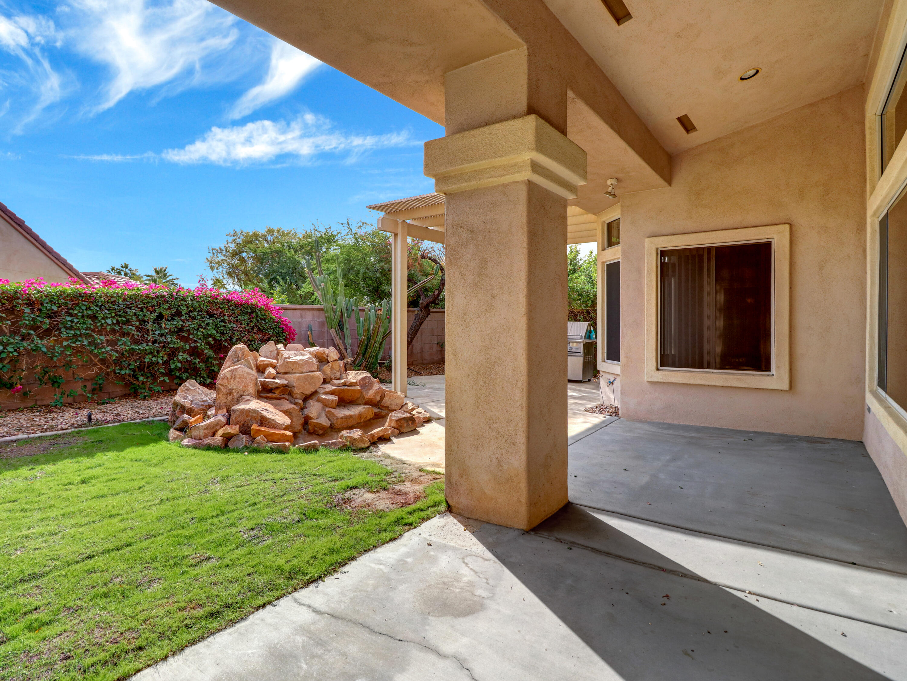 38574 Clear Sky Way Palm Desert, CA 92211 - Photo 39 of 69 a view of a house with backyard and porch