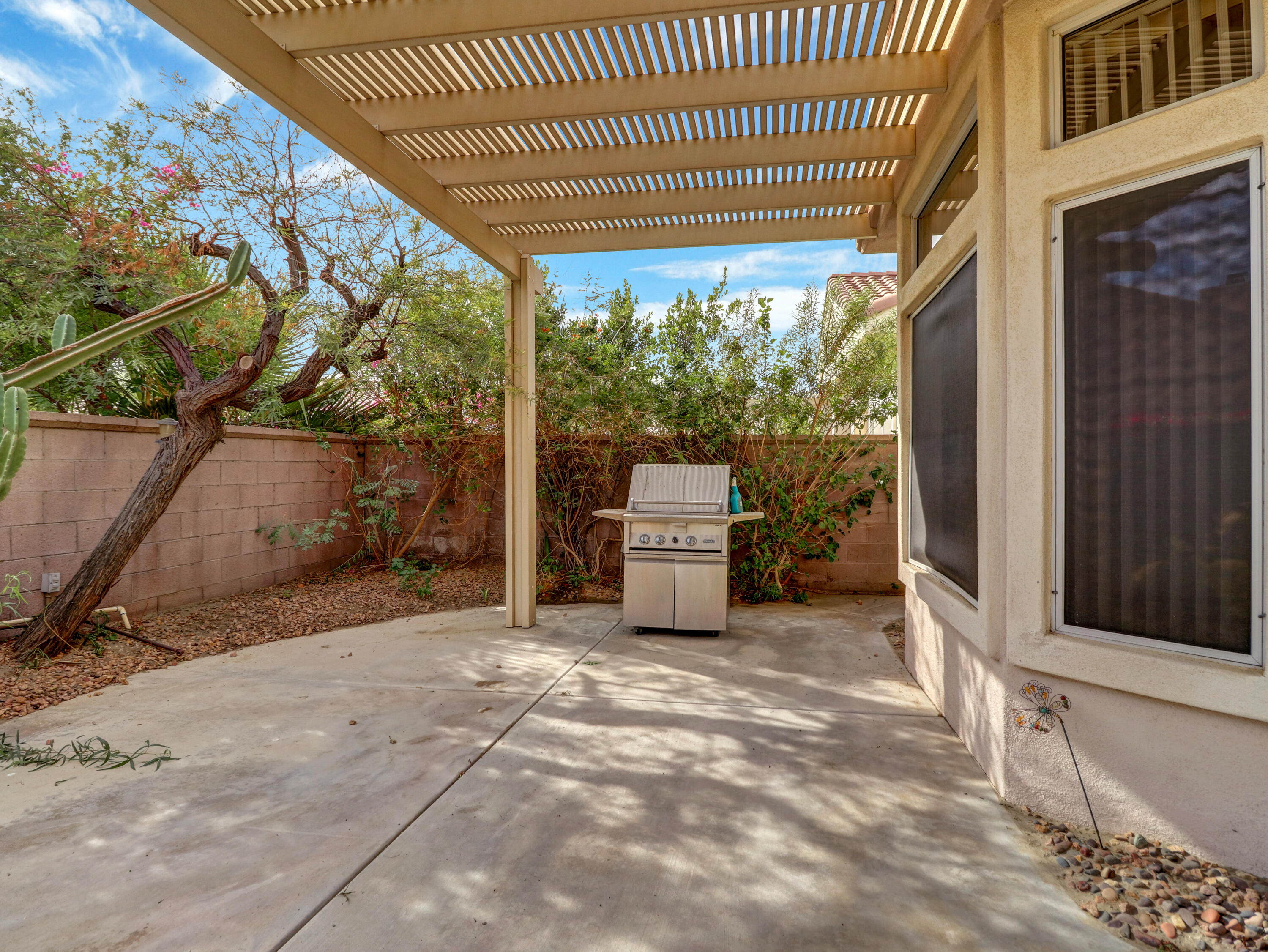 38574 Clear Sky Way Palm Desert, CA 92211 - Photo 41 of 69 a view of a porch with furniture