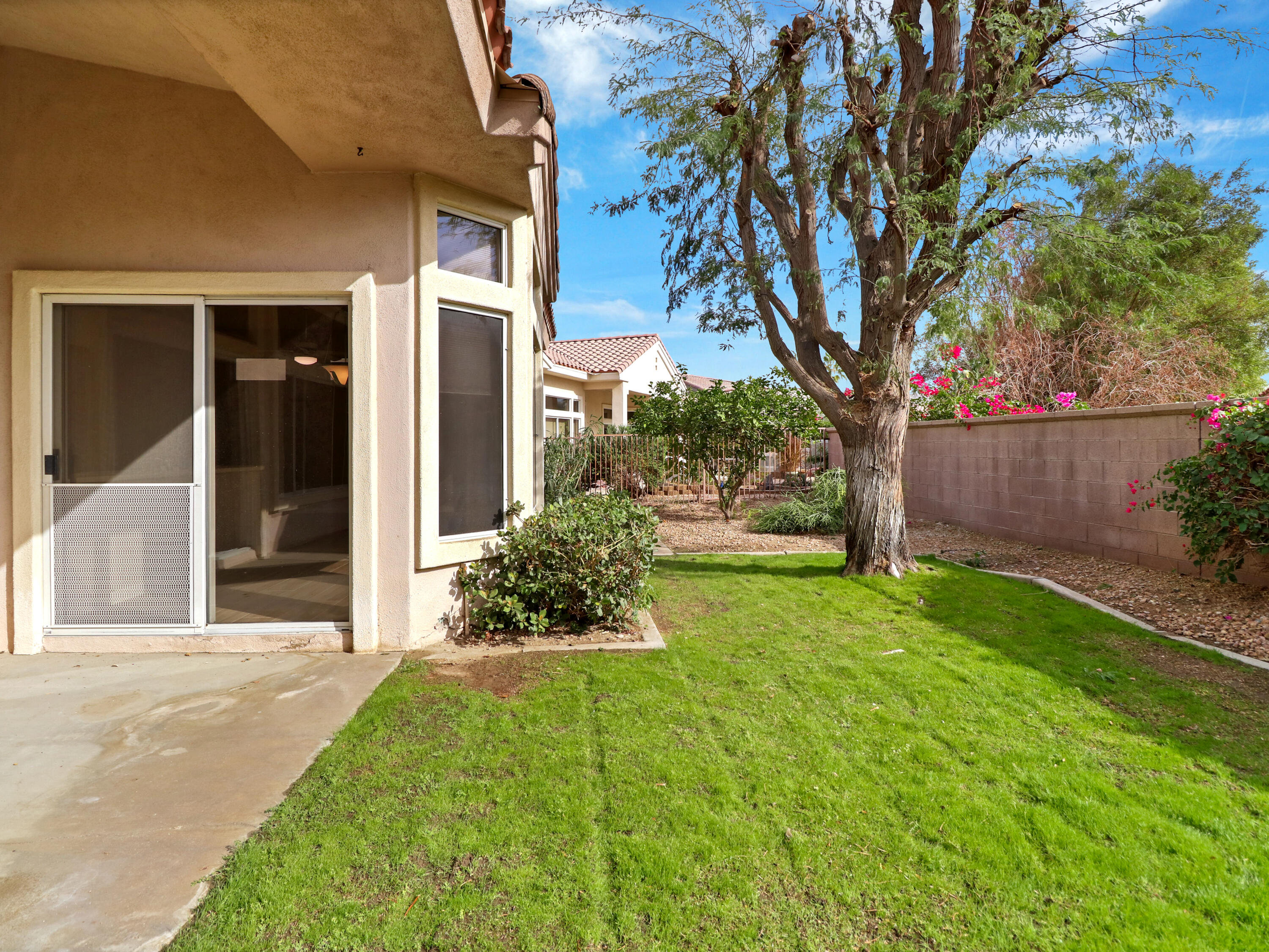 38574 Clear Sky Way Palm Desert, CA 92211 - Photo 42 of 69 a front view of a house with garden