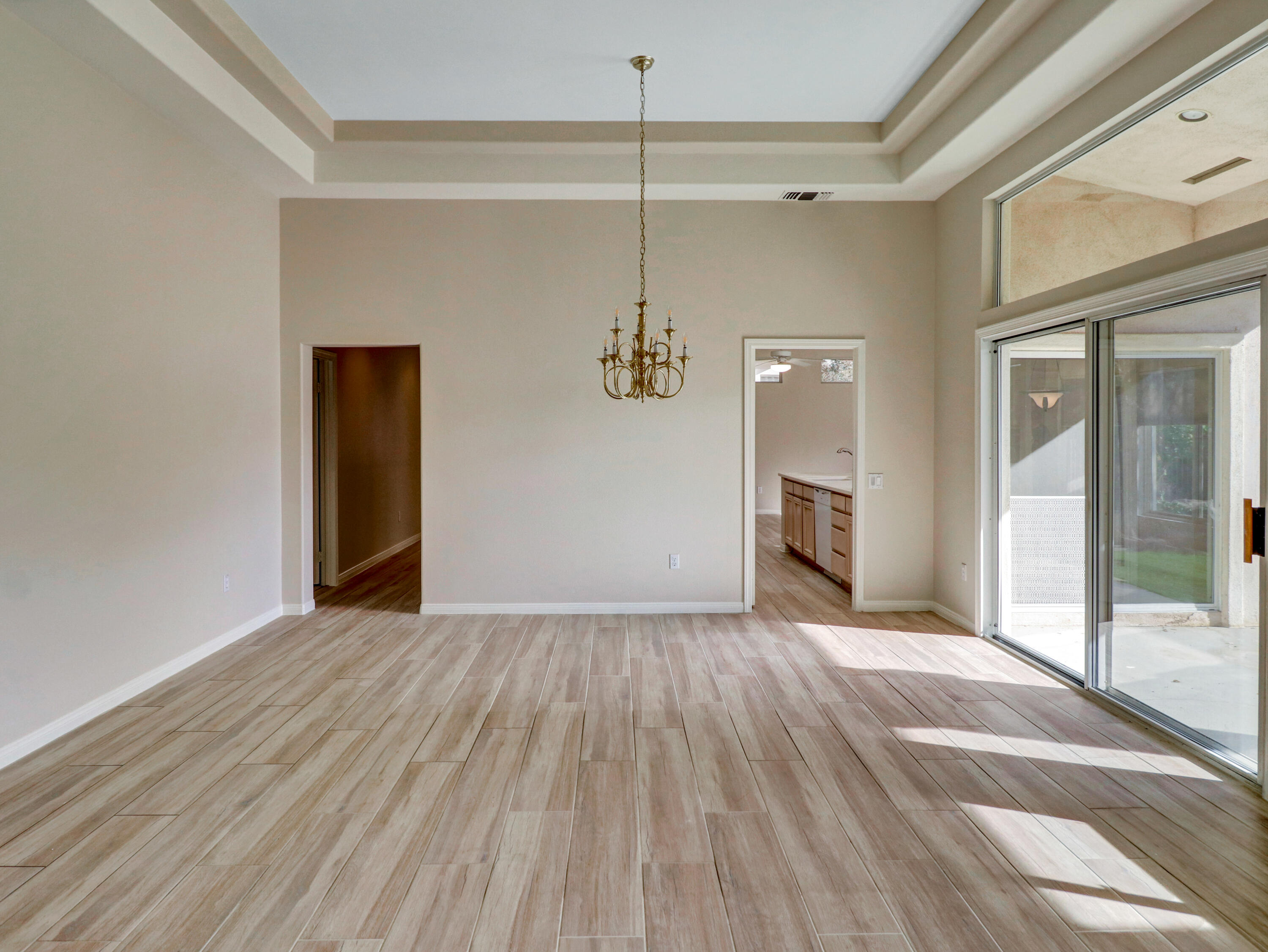 38574 Clear Sky Way Palm Desert, CA 92211 - Photo 7 of 69 a view of a livingroom with wooden floor and a ceiling fan
