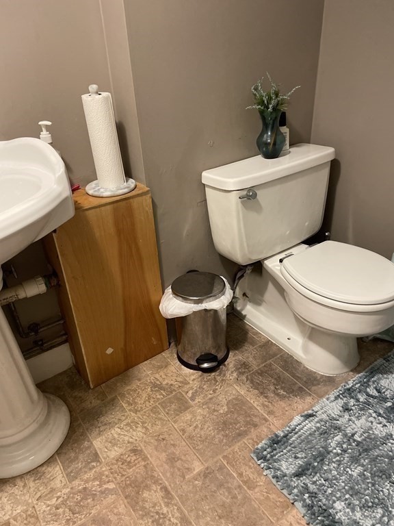 7 Marconi Drive Randolph, MA 02368 - Photo 14 of 24 a bathroom with a toilet and a sink