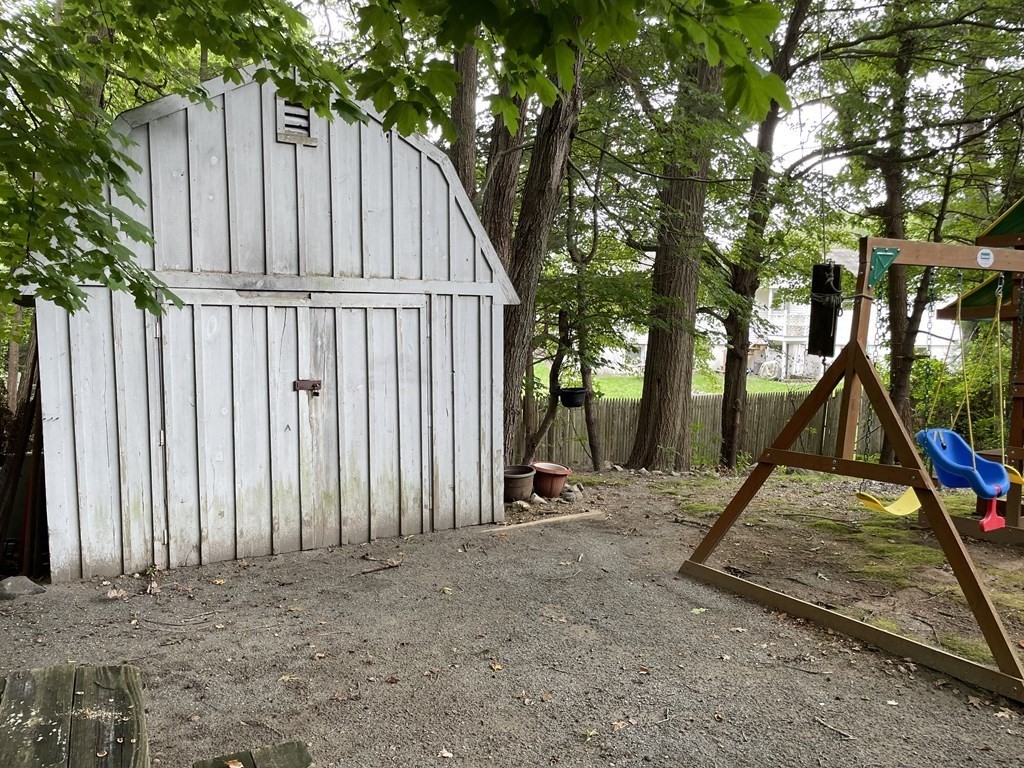 7 Marconi Drive Randolph, MA 02368 - Photo 24 of 24 a view of outdoor space with deck and a tree