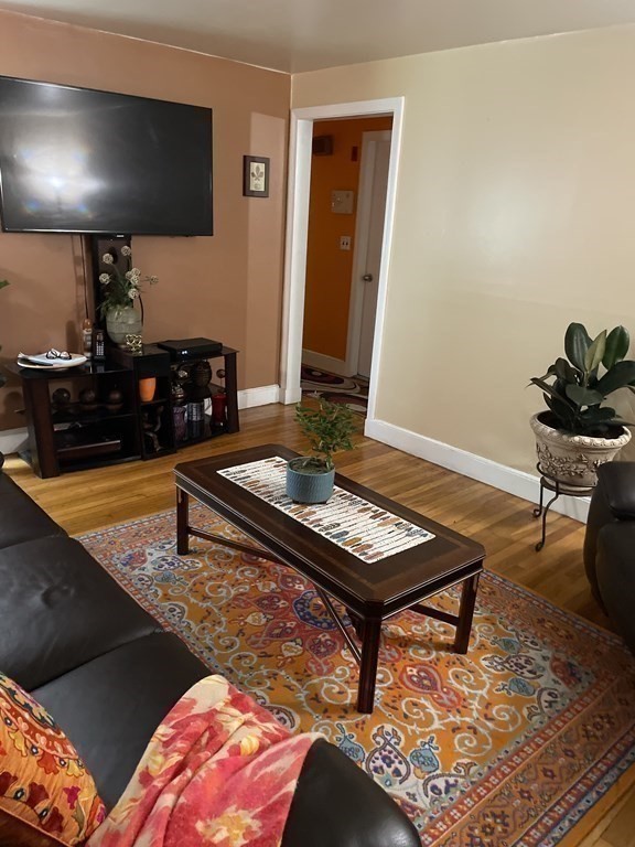7 Marconi Drive Randolph, MA 02368 - Photo 6 of 24 a living room with furniture and a flat screen tv