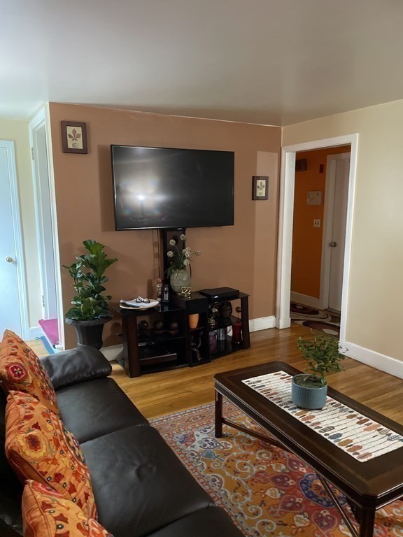 7 Marconi Drive Randolph, MA 02368 - Photo 7 of 24 a living room with furniture and a flat screen tv