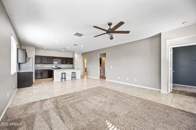 a view of a kitchen with a sink and a refrigerator