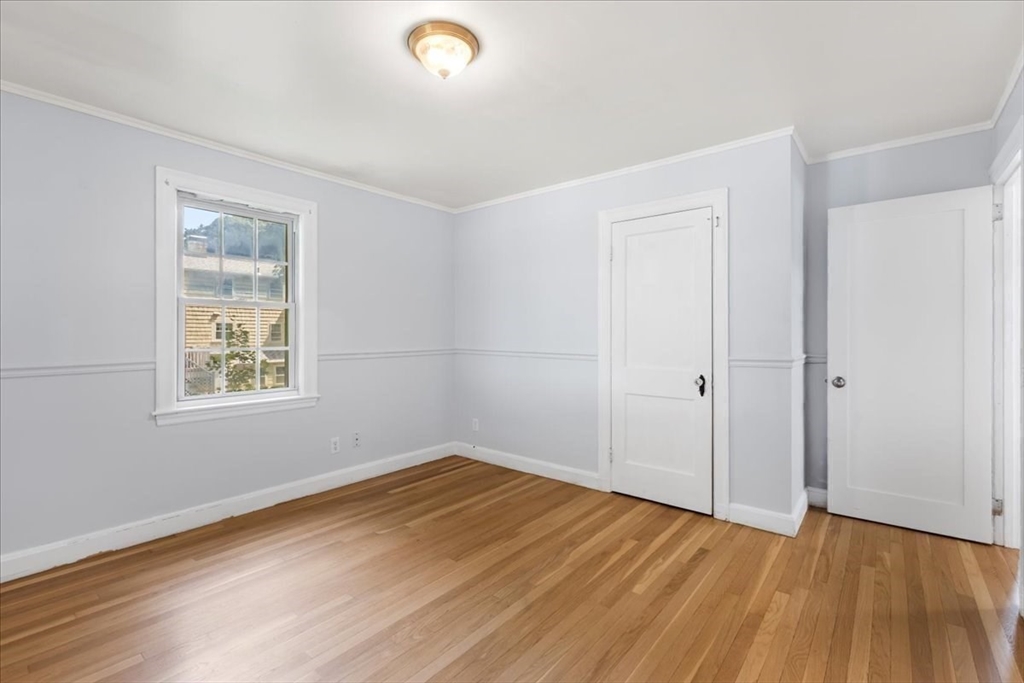 5 Marston Road Walpole, MA 02032 - Photo 12 of 36 an empty room with wooden floor and windows