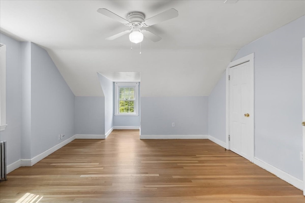 5 Marston Road Walpole, MA 02032 - Photo 22 of 36 a view of an empty room with wooden floor and a window
