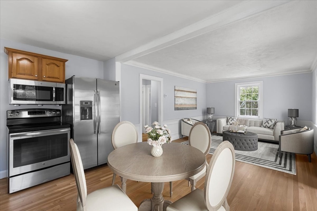 5 Marston Road Walpole, MA 02032 - Photo 3 of 36 a living room with furniture a wooden floor and a fireplace