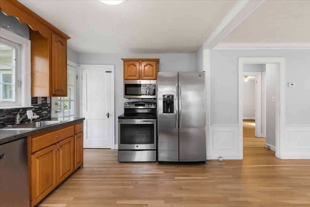 5 Marston Road Walpole, MA 02032 - Photo 8 of 36 a kitchen with granite countertop a refrigerator and a sink