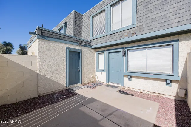 a view of a brick house with a large windows