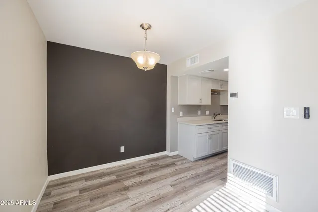 a kitchen with a refrigerator and dishwasher