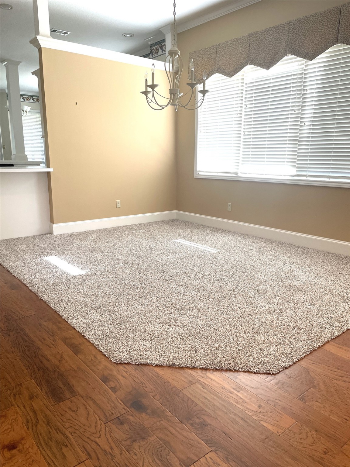 28 Waters Edge Street Conroe, TX 77356 - Photo 5 of 20 a view of empty room with wooden floor and fan