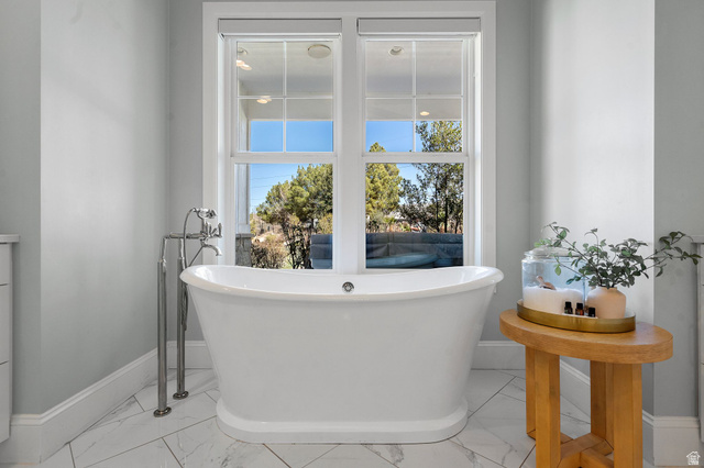 2917 Old Farm Road Washington, UT 84780 - Photo 42 of 105 Bathroom with a freestanding bath and light marble finish floors