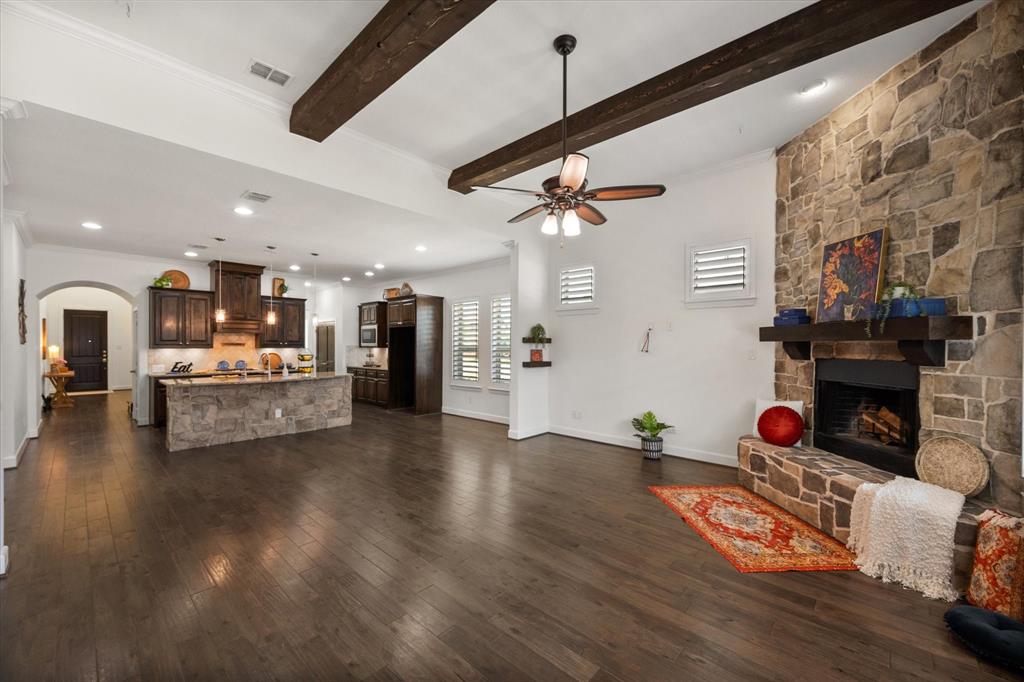 1201 9th Street Argyle, TX 76226 - Photo 15 of 40 a living room with fireplace furniture and a wooden floor