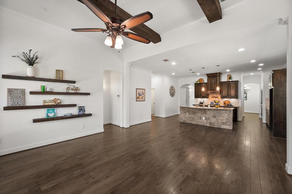 1201 9th Street Argyle, TX 76226 - Photo 16 of 40 a view of a kitchen with furniture and a ceiling fan