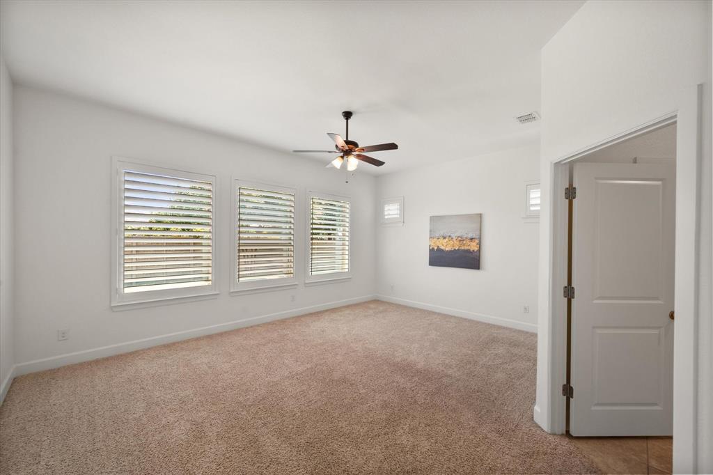 1201 9th Street Argyle, TX 76226 - Photo 18 of 40 a view of a livingroom with a ceiling fan and window