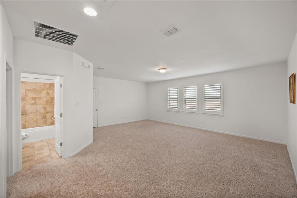 1201 9th Street Argyle, TX 76226 - Photo 24 of 40 an empty room with windows