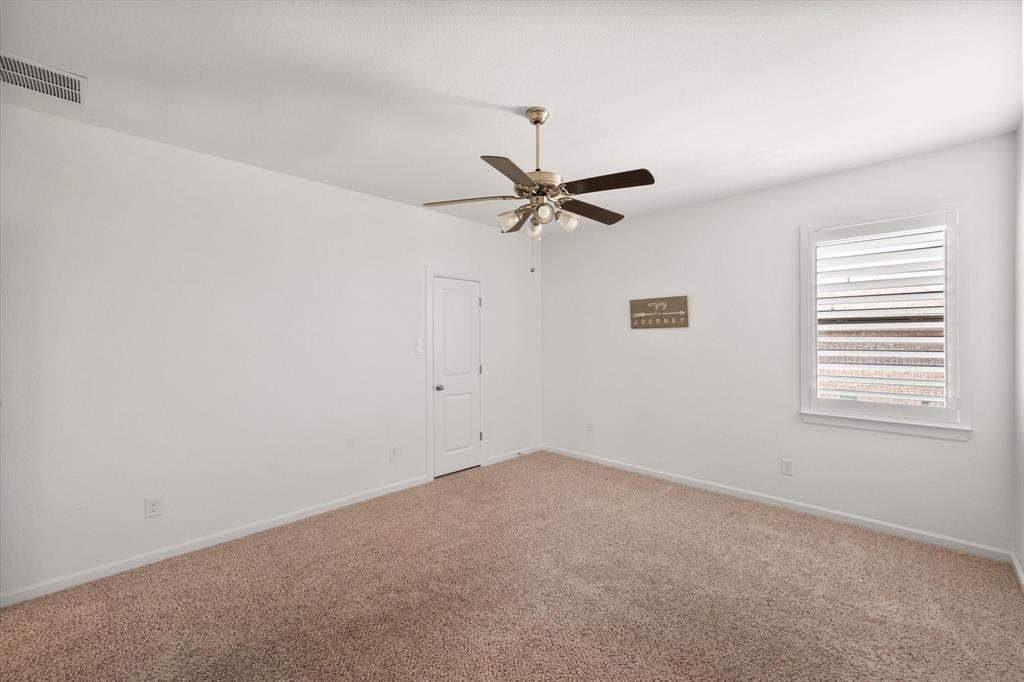 1201 9th Street Argyle, TX 76226 - Photo 27 of 40 a view of a room with a window and a fan