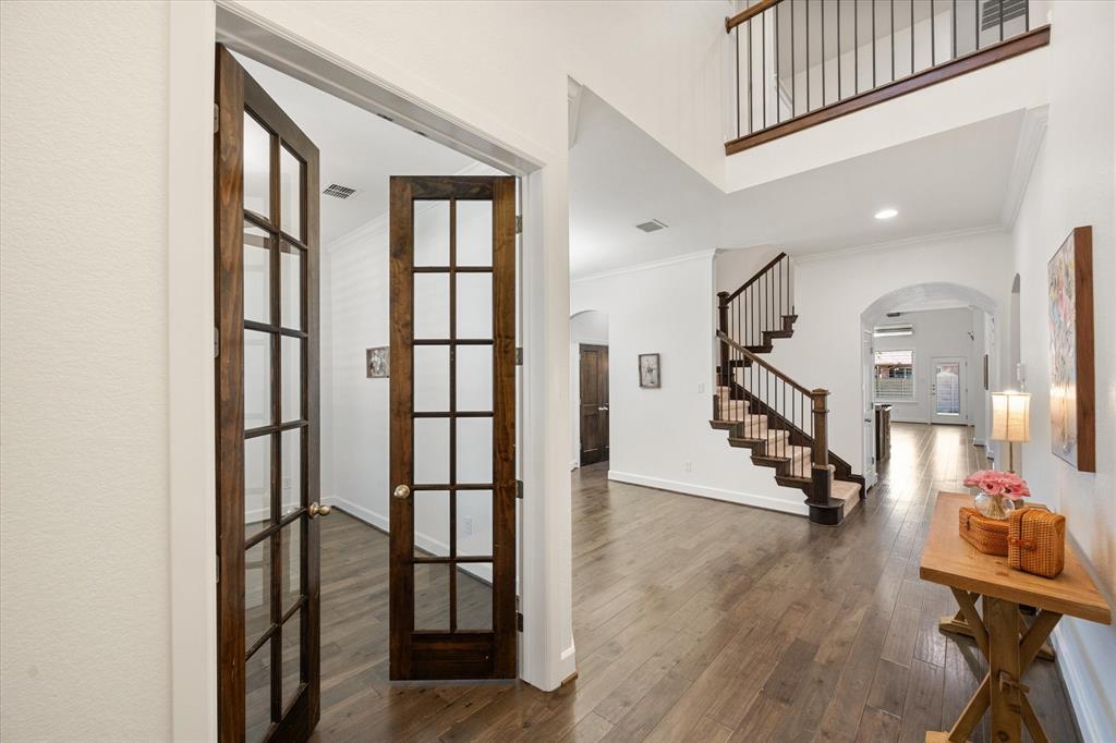 1201 9th Street Argyle, TX 76226 - Photo 3 of 40 a view of entryway with wooden floor and stairs