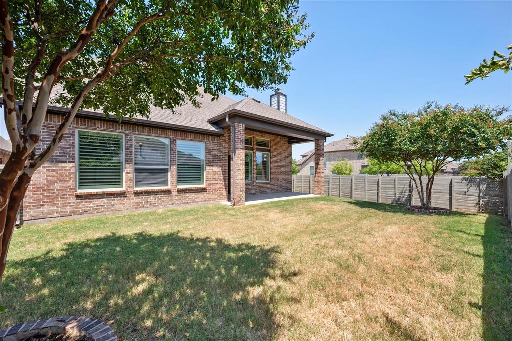 1201 9th Street Argyle, TX 76226 - Photo 32 of 40 a house with trees in front of it