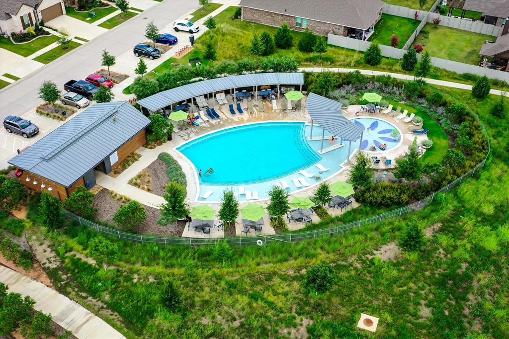 1201 9th Street Argyle, TX 76226 - Photo 35 of 40 an aerial view of a house with a swimming pool outdoor seating and yard