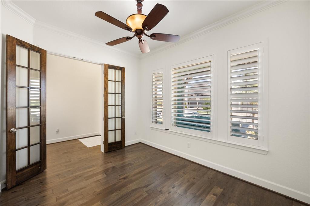 1201 9th Street Argyle, TX 76226 - Photo 4 of 40 wooden floor in an empty room with a window