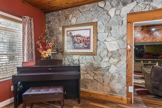 a bathroom with a sink a mirror and a shower