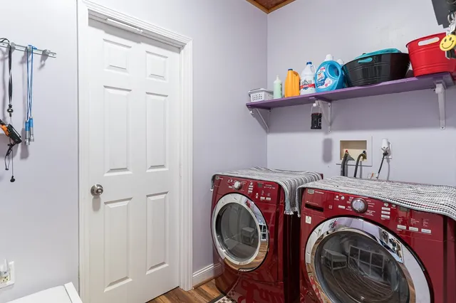 a view of entryway with wooden floor and stairs