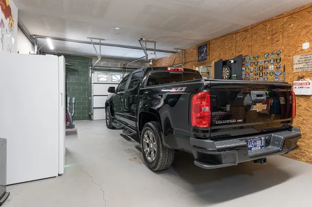 a room with pool table and a chandelier