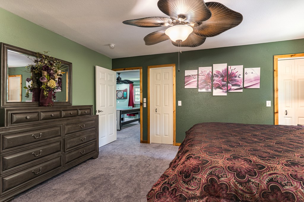 140 Kathryn Circle Murphy, NC 28906 - Photo 27 of 55 a bedroom with a bed and a chandelier