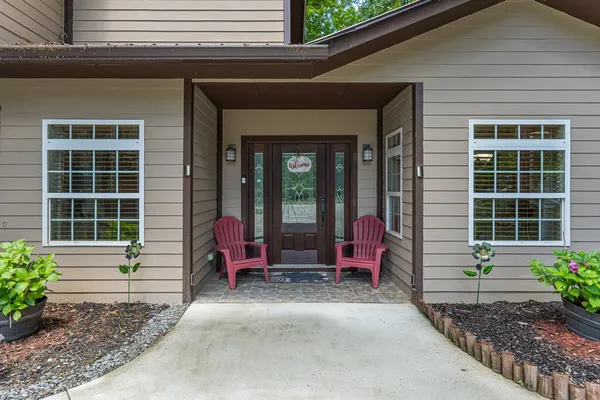 a front view of a house with a yard