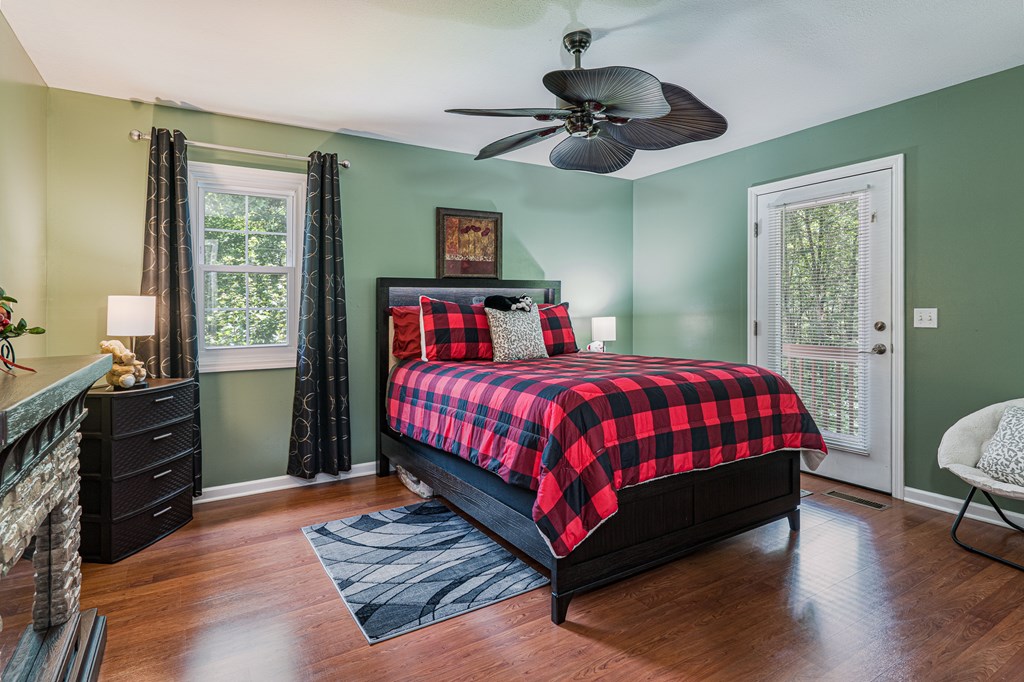 140 Kathryn Circle Murphy, NC 28906 - Photo 38 of 55 a bedroom with a bed and wooden floor