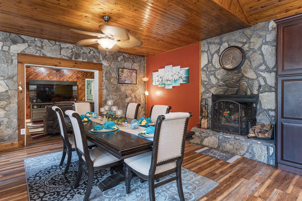 140 Kathryn Circle Murphy, NC 28906 - Photo 5 of 55 a dining room with furniture a fireplace and wooden floor