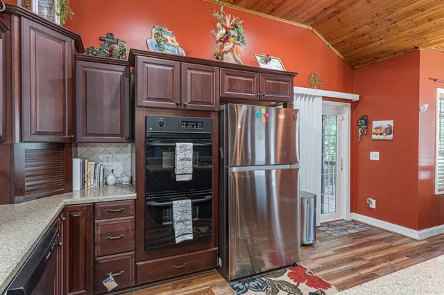 a dining room with a table and chairs