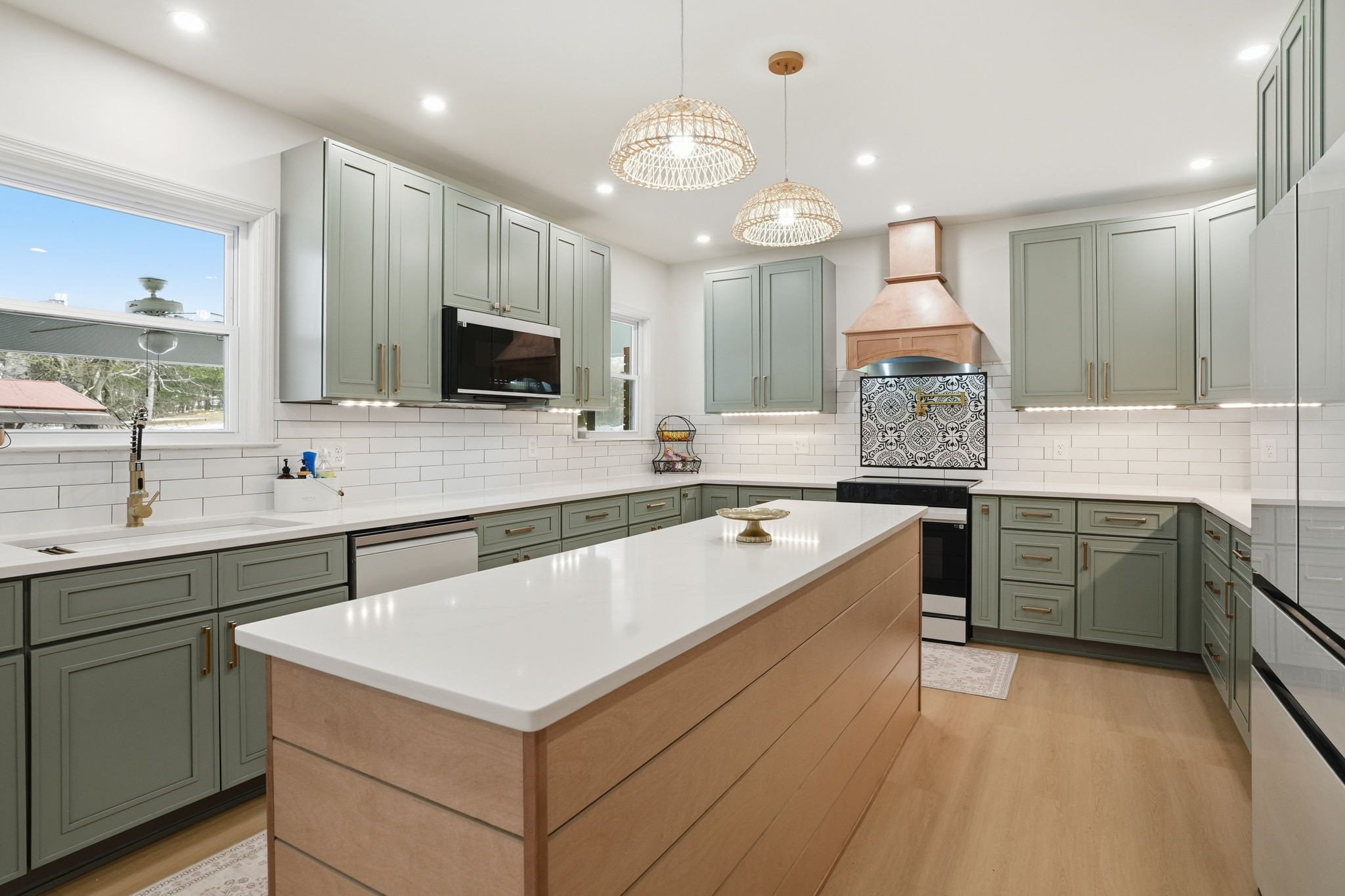 218 Spring Valley Road Hendersonville, TN 37075 - Photo 15 of 60 a large kitchen with a large counter top a sink a stove and cabinets