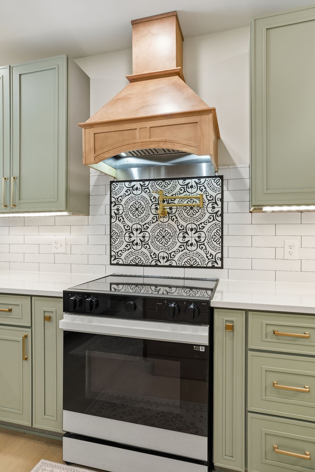 218 Spring Valley Road Hendersonville, TN 37075 - Photo 18 of 60 a stove top oven sitting inside of a kitchen