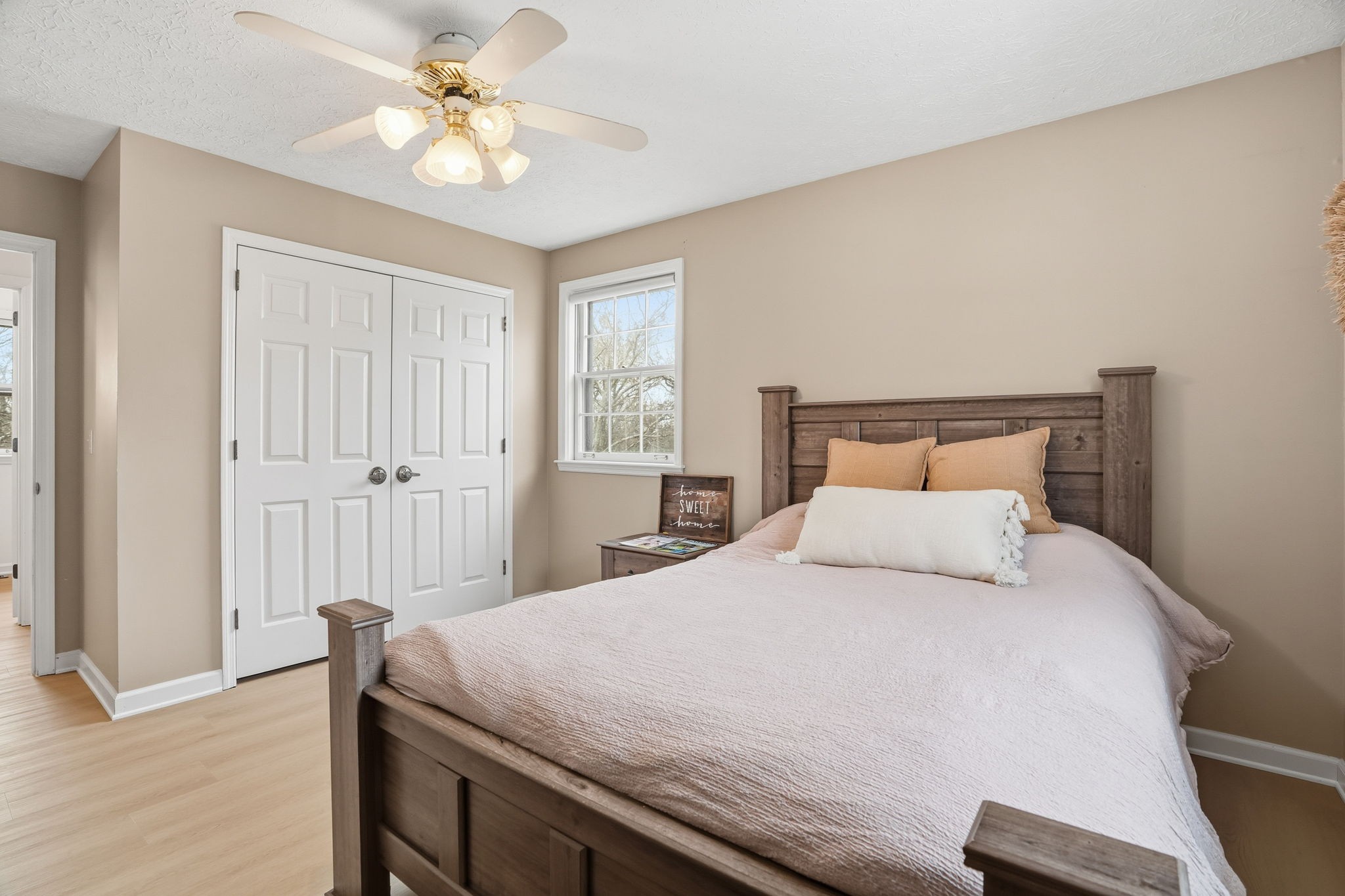 218 Spring Valley Road Hendersonville, TN 37075 - Photo 30 of 60 a bedroom with a bed and a chandelier