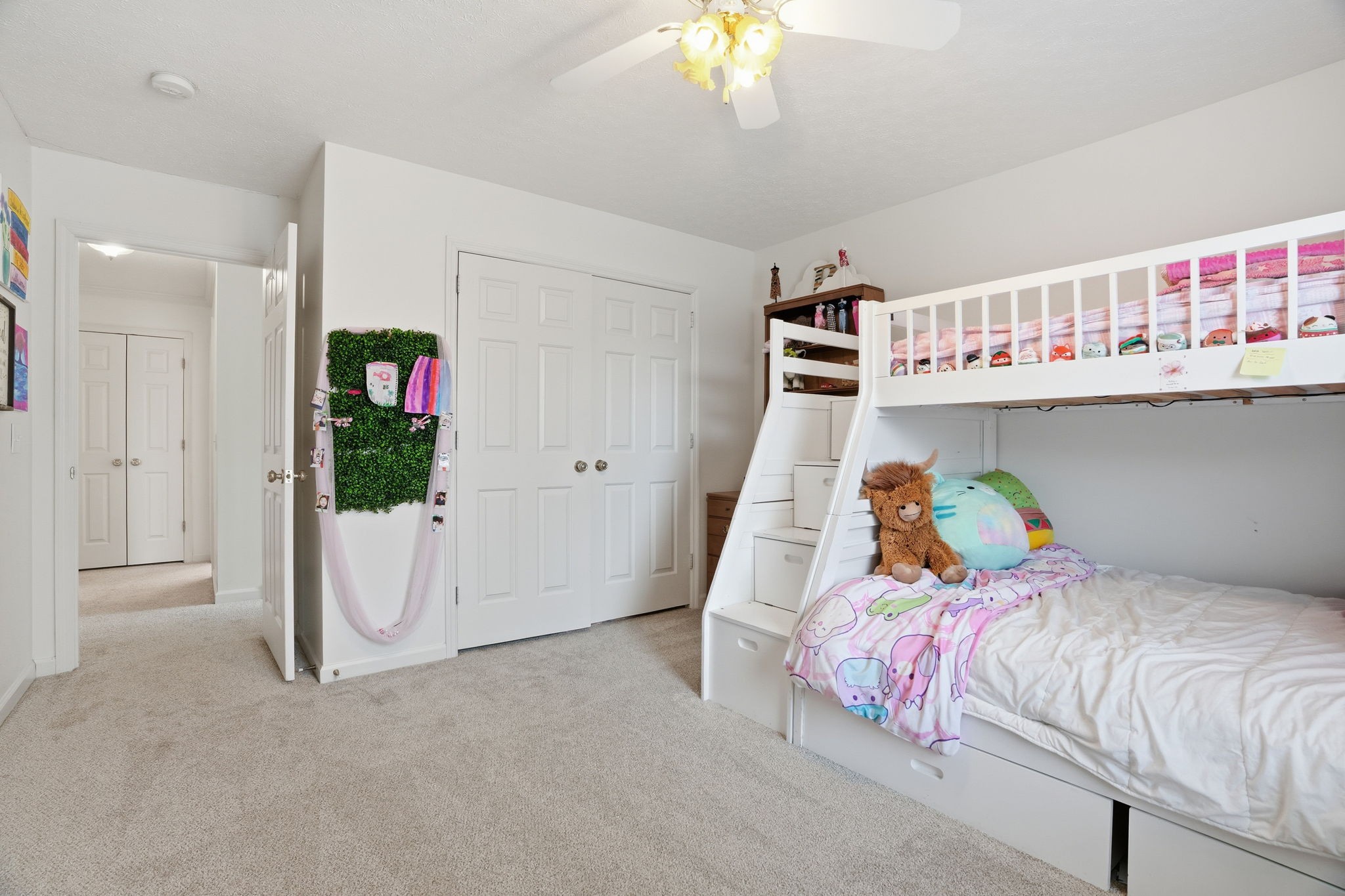 218 Spring Valley Road Hendersonville, TN 37075 - Photo 35 of 60 a bedroom with a bed and a chandelier