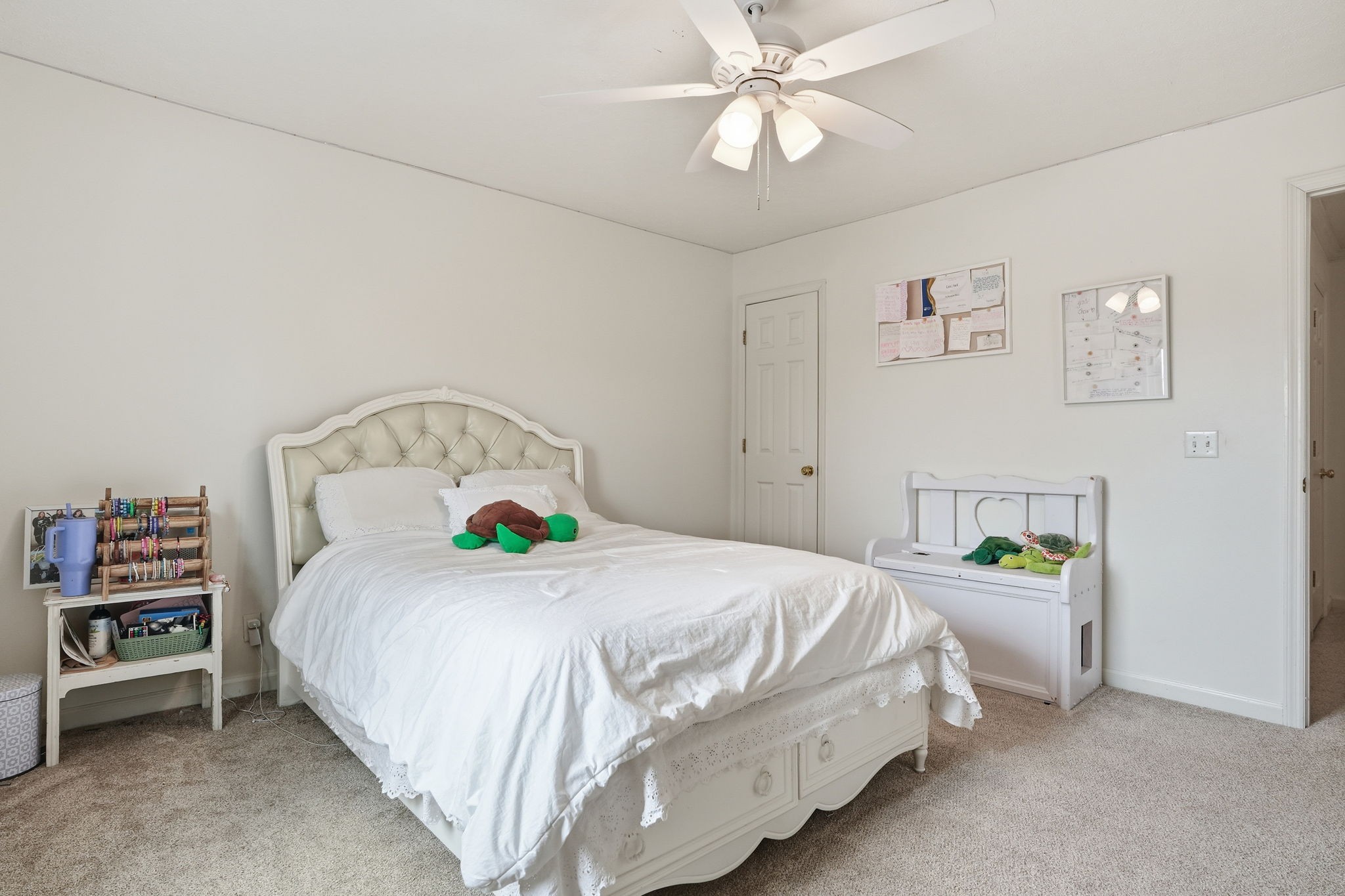 218 Spring Valley Road Hendersonville, TN 37075 - Photo 44 of 60 a bedroom with a bed and a chandelier