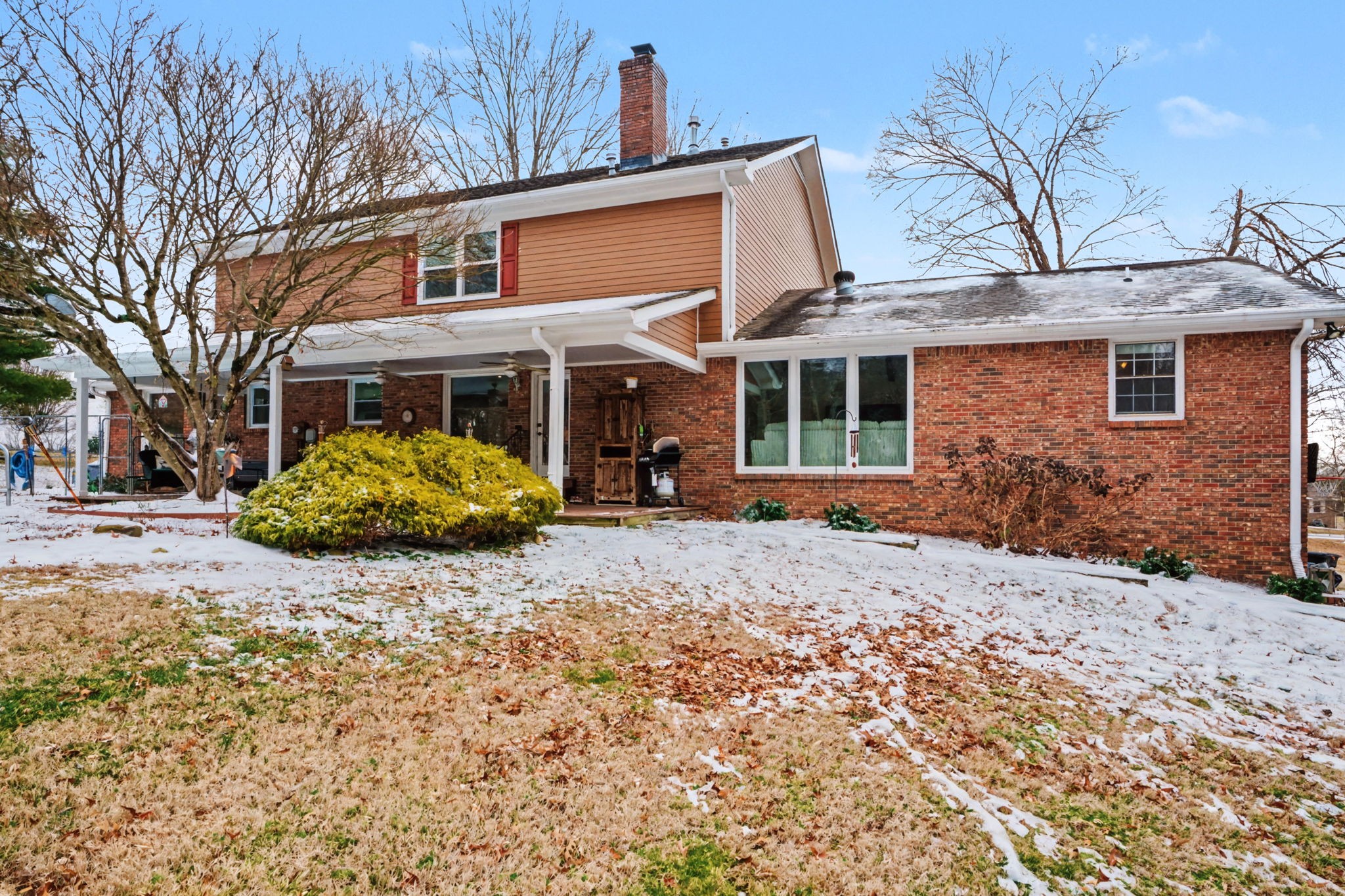 218 Spring Valley Road Hendersonville, TN 37075 - Photo 53 of 60 a front view of a house with a yard covered in snow
